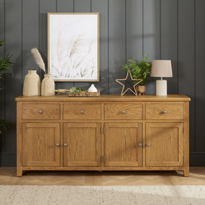 The Furniture Market Cotswold Rustic Smoked Oak Extra Large 4 Drawer 4 Door Sideboard from B&Q