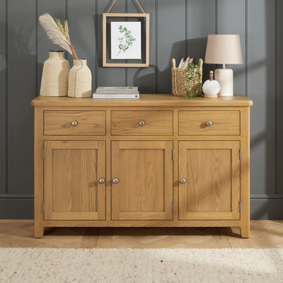 The Furniture Market Cotswold Rustic Smoked Oak Large 3 Drawer 3 Door Sideboard from B&Q