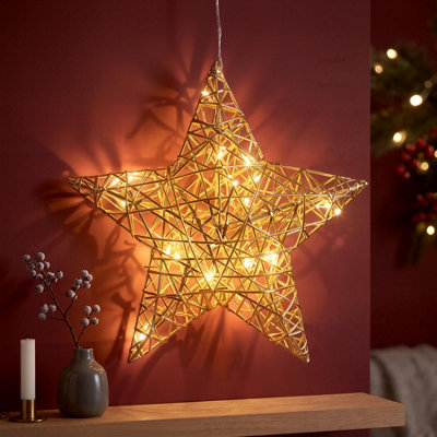 GEEZY LED Light-Up Hanging Christmas Star, 30cm Champagne Gold Metal Frame | Pre-lit 20 warm white micro bulbs illuminate via 6-hour timer. Battery operated 150cm cord fits indoor windows or walls. - Image 3
