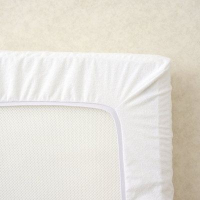 The Tiny Bed Company Waterproof Fitted Mattress ProtectorTravel Cot (104 X 74Cm) from B&Q
