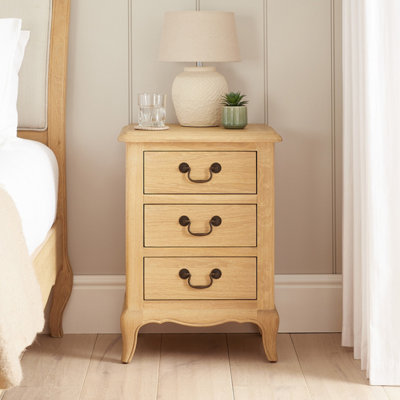 The Furniture Market French Chateau Oak Bedside Table 3 Drawer Solid Nightstand Cabriole Legs Antique Bronze Handles Natural Whitewash Finish from B&Q