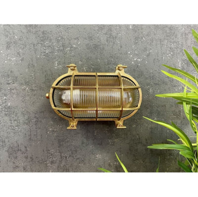 Lampfix Navigator 05844 Outdoor Ip64 1 Light Large Standard Bulkhead Light In A Raw Brass Finish from B&Q