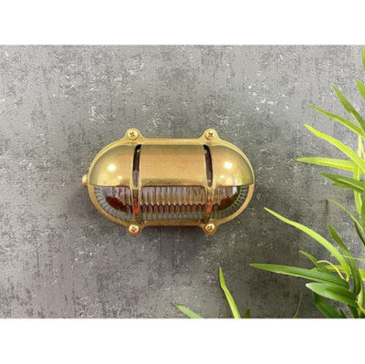 Lampfix Navigator 09608 Outdoor Ip64 1 Light Decorative Eyelid Bulkhead Light In A Raw Brass Finish from B&Q