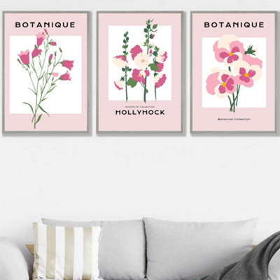 Artze Wall Art Pink Hollyhock Flower Market Set Of 3 Wall Art Prints With Light Grey Frame. Size: 50X70Cm from B&Q