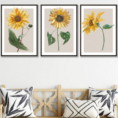 Artze Wall Art Vintage Sunflowers On Beige Set Of 3 Wall Art Prints With Black Frame. Size: A2 from B&Q