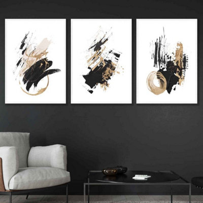 Artze Wall Art Set Of 3  Abstract Black Ivory And Gold Oil Strokes Wall Art Prints / 42X59Cm (A2) / White Frame from B&Q