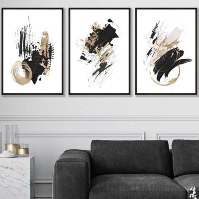 Artze Wall Art Set Of 3  Abstract Black Ivory And Gold Oil Strokes Wall Art Prints / 50X70Cm / Black Frame from B&Q
