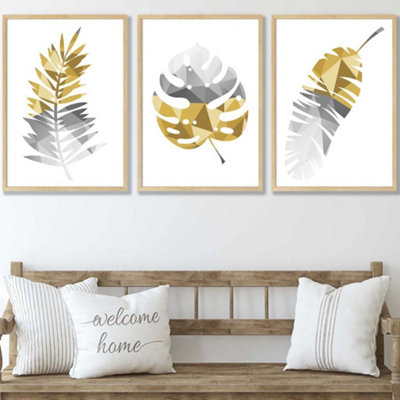 Artze Wall Art Set Of 3 Geometric Tropical Leaves In Yellow Grey Wall Art Prints / 50X70Cm / Oak Frame from B&Q