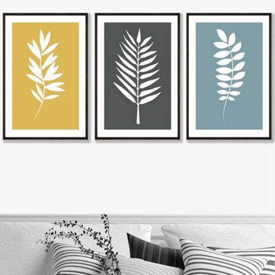 Artze Wall Art Set Of 3 Framed YellowGreyBlue Graphical Leaves Wall Art Prints / 50X70Cm / Black Frame from B&Q