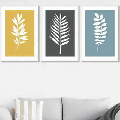 Artze Wall Art Set Of 3 Framed YellowGreyBlue Graphical Leaves Wall Art Prints / 50X70Cm / White Frame from B&Q