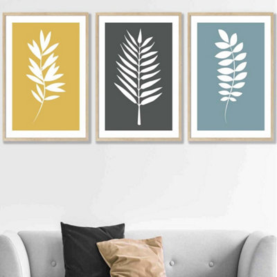 Artze Wall Art Set Of 3 Framed YellowGreyBlue Graphical Leaves Wall Art Prints / 50X70Cm / Oak Frame from B&Q