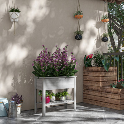 Outsunny Wooden Raised Garden BedElevated Planter Box With Storage Shelf from B&Q