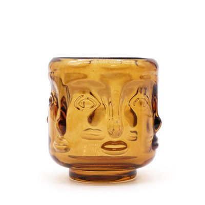 Serene Buddha Faces Candle JarAntique Amber Decor & Ambiance from B&Q