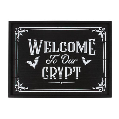 Welcome To Our Crypt Wall Plaque from B&Q
