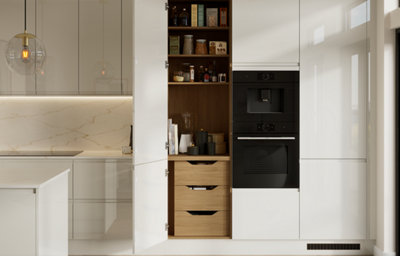 The Garcinia kitchen features glossy slab doors with integrated handles in a light neutral tone, complemented by warm wood interiors and marble-effect worktops for a sleek, elegant finish.