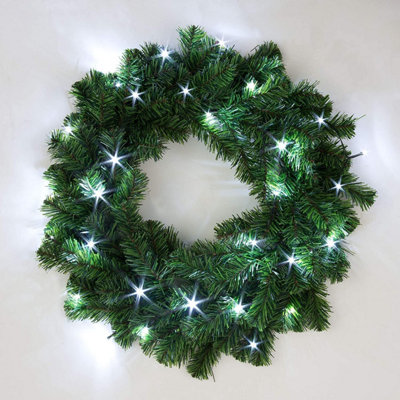 55cm Pre-Lit Green Christmas Wreath Alaskan Pine with 30 Ice White LEDs