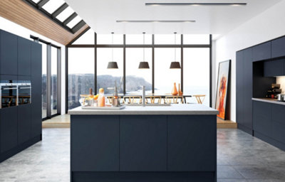 An island view of the Ethos kitchen, featuring sleek dark blue cabinets and light marble countertops.