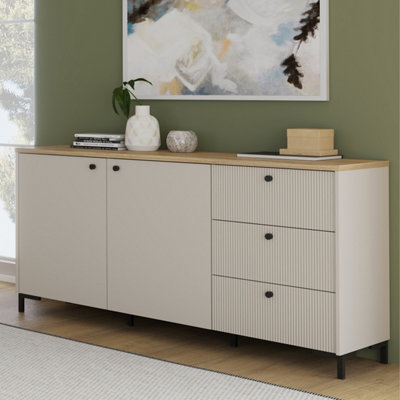 Furniture To Go Bixbite Wide Sideboard With Fluted Drawers And Cupboard In Mauvella Oak And Sand from B&Q