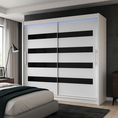 Bega Xi 180 Wardrobe With Sliding Doors Hanging Rail Shelves White With Black And Led Lights from B&Q