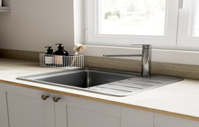 Two deep shaker-style kitchen drawers in light grey are open to reveal clever storage options. The bottom drawer has dividers for organising bowls or pots. The top drawer front houses two drawers - at the bottom a drawer deep enough for mugs, and a top drawer with a pull tab that houses cutlery.