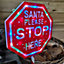 65cm Light Up Christmas Red and White Santa Stop Here Outdoor Sign with 45 Multi Colour LED