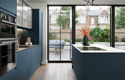The Garcinia kitchen features matt slab doors with integrated handles in a deep ocean blue, bringing a calm, contemporary feel that flows seamlessly into light-filled spaces.