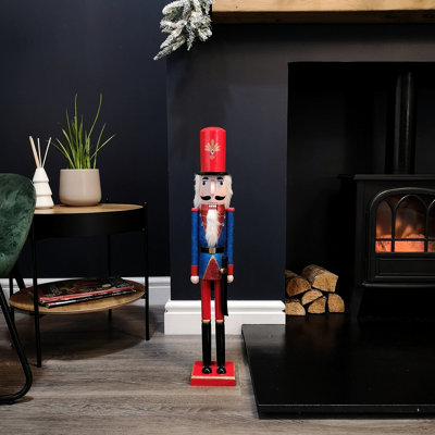 https://media.diy.com/is/image/KingfisherDigital/70cm-indoor-traditional-wooden-christmas-nutcracker-decoration-in-blue~5056589117832_02c_MP?$MOB_PREV$&$width=618&$height=618