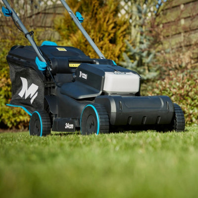 A MacAllister lawnmower sitting on a lawn.