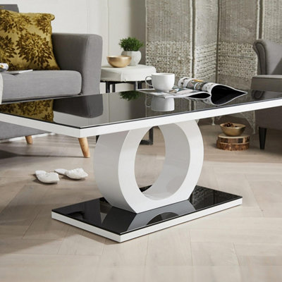 Furniturebox Giovani Rectangular White High Gloss Coffee Table With Black Glass Top And Unique Halo Structural Plinth Base Design from B&Q