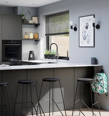 Dark grey kitchen with a breakfast bar and open shelving.