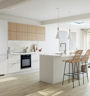 A large white Scandi kitchen with a white marble worktop and splashback, and light wood effect flooring.