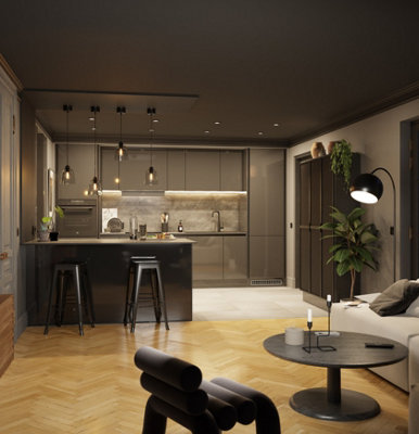 Dark grey open plan kitchen with multiple light sources; pendant lights, spotlights, under cabinet lighting and a floor lamp in the living area.
