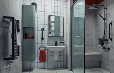Modern accessible family wet room with a matt black walk-in shower, matt black mixer shower, matt green wall cabinet, ceramic stone-effect tiles, and matt black accessories.