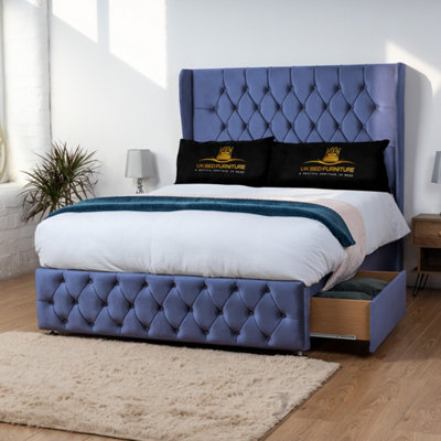 UKBEDFURNITURE Luxor Blue Plush Wingback Divan Bed With 2 Foot End Drawers & 54 Inch Headboard from B&Q