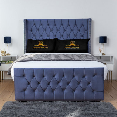 UKBEDFURNITURE Emily Blue Plush Wingback Divan Bed Base With 54 Inch HeadboardNo Storage from B&Q