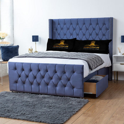 UKBEDFURNITURE Emily Blue Plush Wingback Divan Bed With 2 Foot End Drawers & 54 Inch Headboard from B&Q