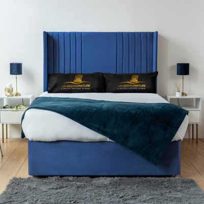 UKBEDFURNITURE Skyline Blue Plush Wingback Divan Bed Base With 54 Inch HeadboardNo Storage from B&Q