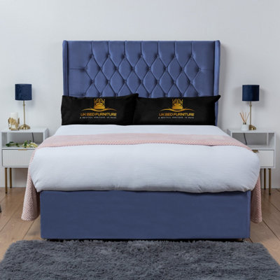 UKBEDFURNITURE Mary Blue Plush Wingback Divan Bed Base With 54 Inch HeadboardNo Storage from B&Q