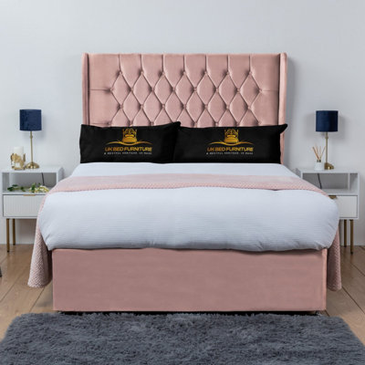 UKBEDFURNITURE Mary Pink Plush Wingback Divan Bed Base With 54 Inch Headboard & 10 Inch Orthopaedic MattressNo Storage from B&Q