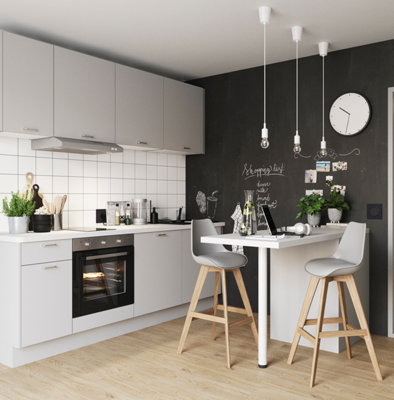 Small light grey and wooden Scandi style kitchen with a blackboard feature wall.