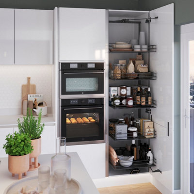 White kitchen with tall storage cabinets and integrated appliances.