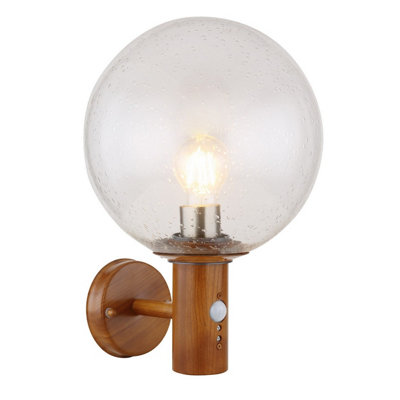 Luminosa Lighting Luminosa Ossy Pir Globe Wall Lights Wood Look Ip44 Clear With Air Bubbles Glass Shade 1X E27 Dawn Dusk Sensor from B&Q