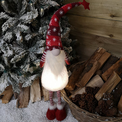 https://media.diy.com/is/image/KingfisherDigital/90cm-tall-christmas-gnome-gonk-nordic-decoration-red-snowflake-hat-standing~5060907227721_01c_MP?$MOB_PREV$&$width=618&$height=618