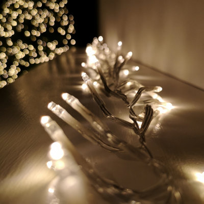 960 LED 12m Premier Cluster Indoor Outdoor Multi Function Mains Operated Christmas Lights with Timer on Clear Cable in Warm White