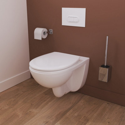 A wall-hung toilet with a wall-hung toilet roll holder and a wall-hung toilet brush installed on either side.