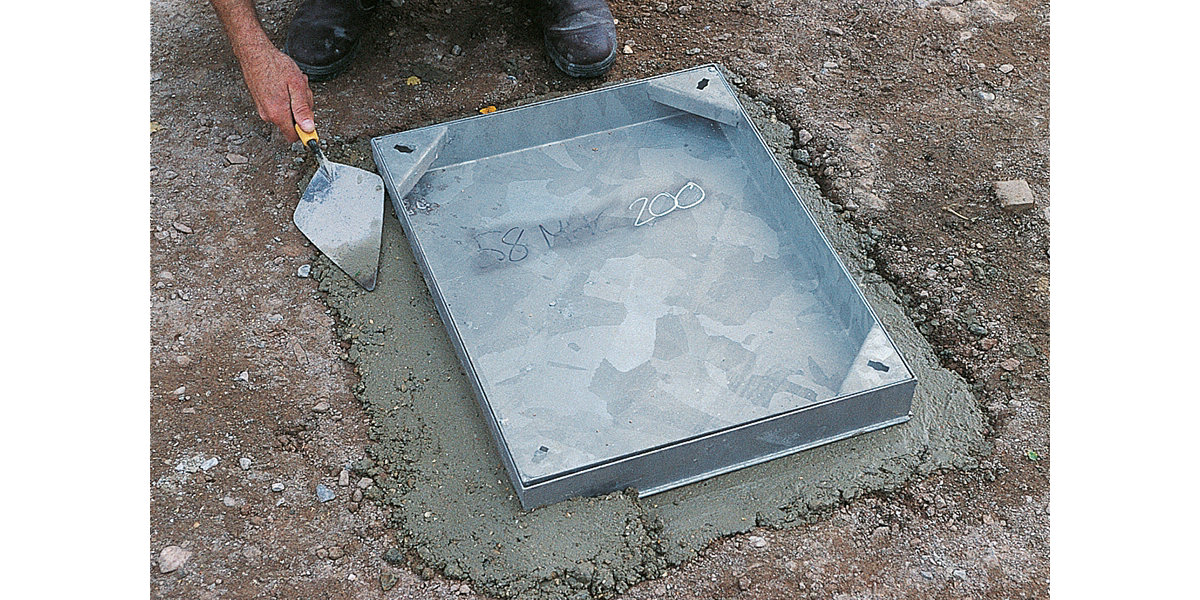 How do you open a manhole cover quickly and ergonomically? 