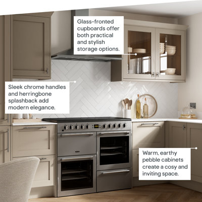 Earthy, warm grey cabinets create a cosy and inviting space. Sleek chrome handles and herringbone splashback add modern elegance. Glass-fronted cupboards offer both practical and stylish storage options.