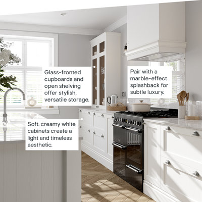 Soft, creamy white cabinets create a light and timeless look. Glass-fronted cupboards and open shelving offer stylish, versatile storage. Pair with a marble-effect splashback for subtle luxury.