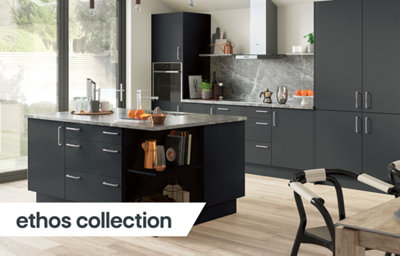 The Ethos kitchen, featuring sleek black cabinets, chrome fixtures and cupboard handles, and grey marble-effect countertops.