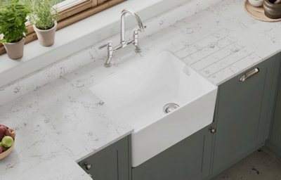 The Tydeman kitchen, featuring shaker style cabinets in muted, earthy green.